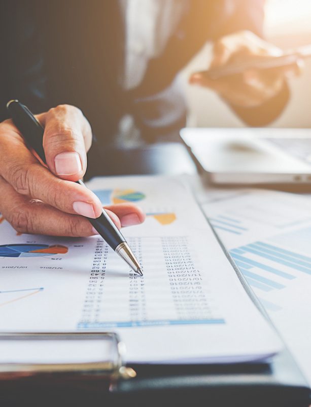 Business concept. Business people discussing the charts and graphs showing the results of their successful teamwork.